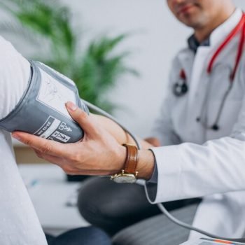 Doctor measuring blood pressure